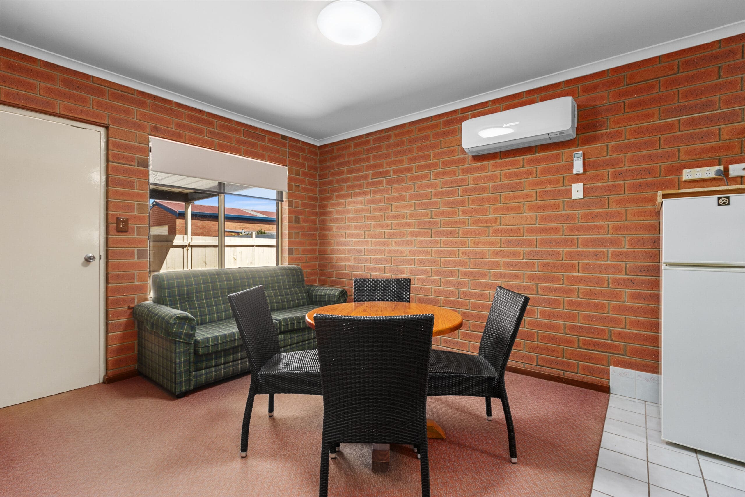 Queen Room with large dining room area.