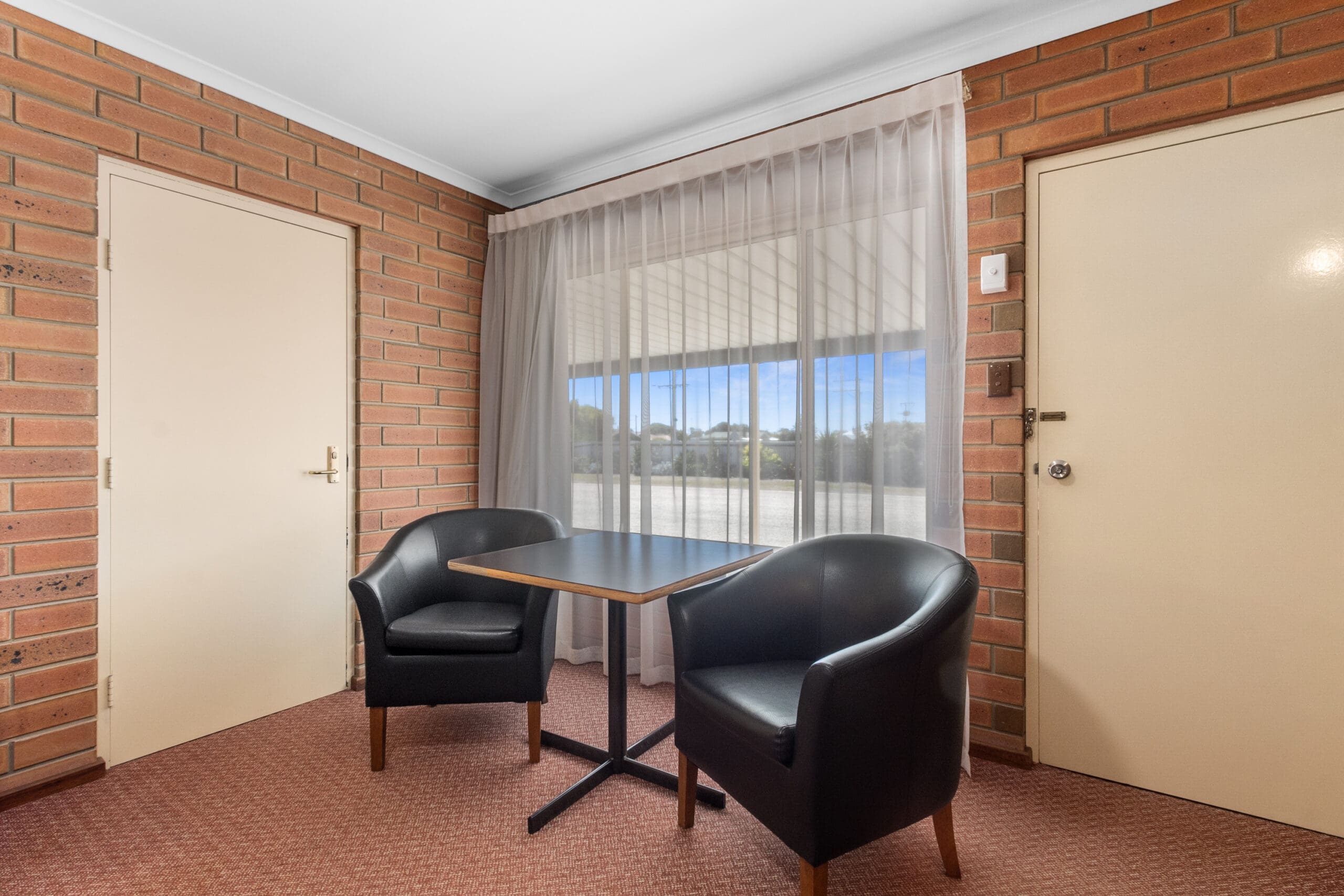 Queen room, with dining table area.